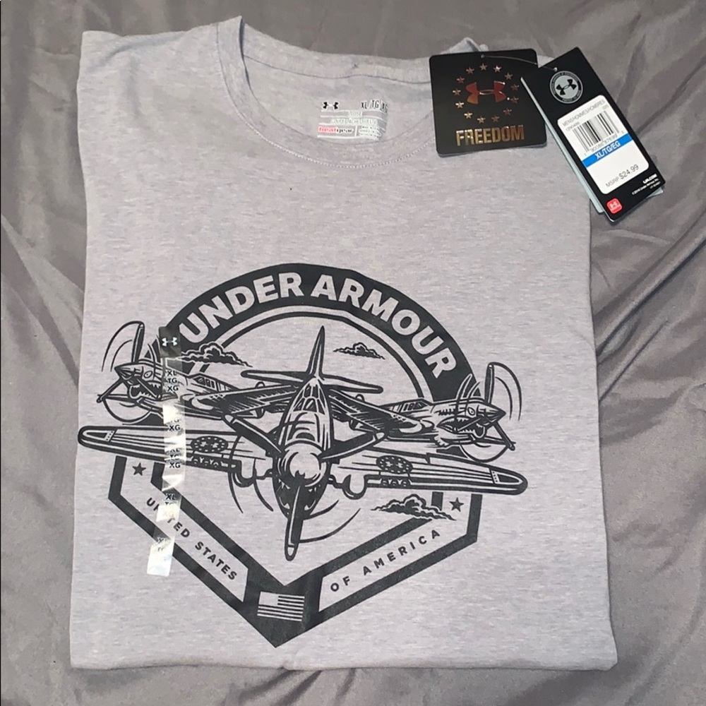 NEVER WORN WITH TAGS. UA men’s/teens shirt